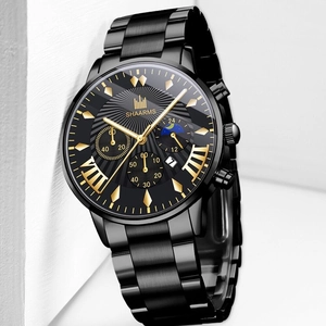 Detail view of SHAARMS black metal watch with gold markers and three sub-dials