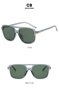 Detail view of square pilot sunglasses featuring grey frames and golden T-shaped hinges