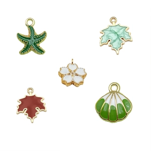 18K gold plated stainless steel ocean theme charms including starfish and shell pendants