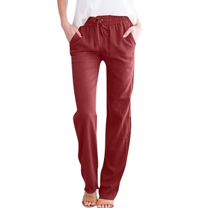 Detail of burgundy linen pants featuring adjustable drawstring waist and relaxed straight cut
