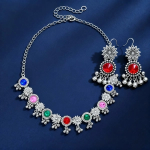 Vintage floral necklace and earring set with colorful gemstones and bell tassels