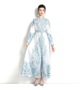 Detail of elegant paisley print maxi dress with stand collar and matching waist belt