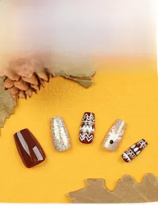 Detailed Christmas ballet nails featuring red reindeer patterns and gold glitter accents
