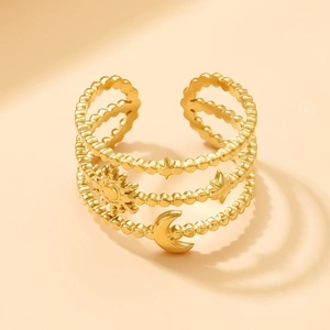 Adjustable gold stainless steel ring with sun moon and star motifs on a layered band