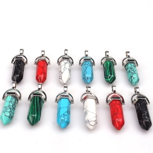 Set of twelve hexagonal quartz crystal point pendants in various vibrant natural colors