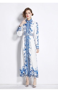 Detailed view of blue and white floral print on a long-sleeved midi dress with belt