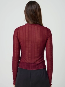 Detailed back view of burgundy long sleeve top with sheer vertical ribbed texture
