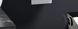 Close-up of smart bathroom tissue holder with Bluetooth control knob and marble texture