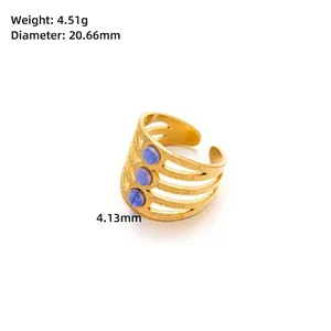 Detailed view of golden hollow ring with three blue stones and measurement details