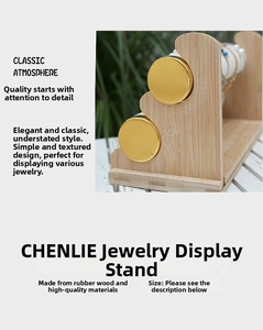 Close-up of bamboo wood jewelry stand featuring gold metal accents and natural texture