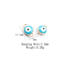 Macro detail of 11.1mm gold-plated Evil Eye alloy charms showing exact dimensions