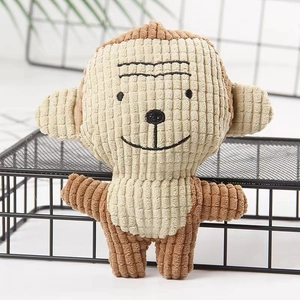 Close-up of a brown corduroy monkey plush dog toy with soft textures for dental chewing
