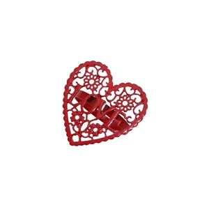 Close-up of red hollowed heart-shaped napkin ring with floral details and LOVE text