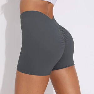 Detailed back view of high-waisted dark grey scrunch butt yoga shorts for fitness