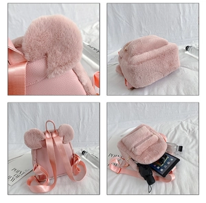 Detail view of pink plush backpack showing furry ears, PU leather and inner storage space
