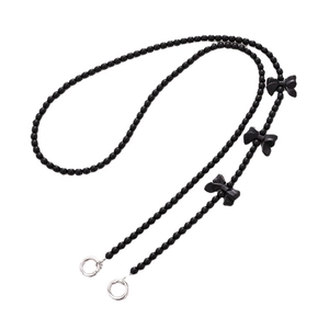 Handmade black beaded crossbody phone chain featuring elegant bows and silver clasps