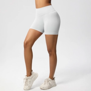 Detail view of seamless high-waist fitness shorts in light gray with sculpting fit