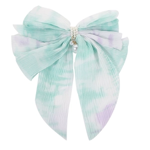 Detail of gradient chiffon bow hair clip with pleated texture and pearl decorations