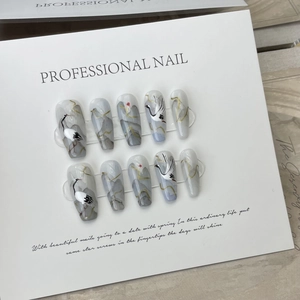 Chinese ink style press-on nails featuring crane and mountain watercolor art design