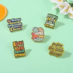 Set of 5 motivational enamel pins with colorful lacquer finish and gold metal edges
