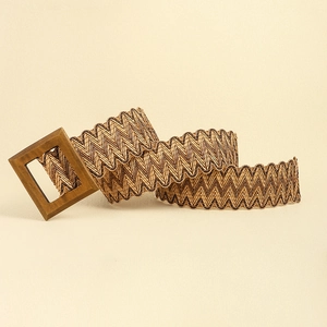 Detailed view of woven straw belt featuring a square wooden buckle and natural textures