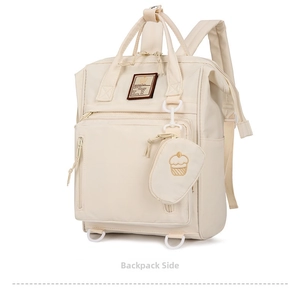 Detail of beige waterproof diaper backpack with side pocket and cupcake embroidery