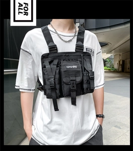 Detailed view of black tactical chest rig featuring MOLLE system and multiple storage pockets