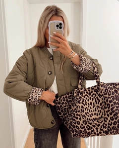Army green quilted jacket with leopard lining and matching leopard handbag in a mirror selfie