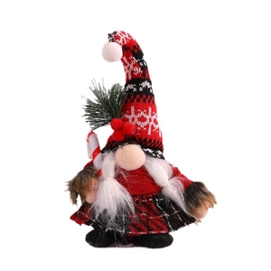 Christmas gnome doll with red black knit hat and candy cane for holiday home decoration