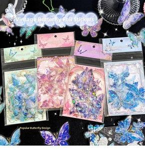 Detail of laser gold butterfly stickers in pink, purple, blue and green PET material