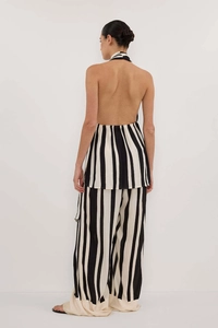 Rear view of elegant backless halter top and wide leg pants set with black stripes