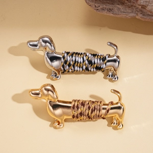 Metallic dachshund brooches in gold and silver finish with colorful braided rope wrap