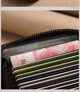 Macro detail of the dark brown leather accordion card holder with multi-slot storage