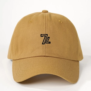 Detailed close-up of 7L embroidery on a khaki cotton twill baseball cap with reinforced stitching