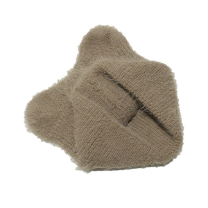 Detailed macro view of soft khaki faux fur knit material with fluffy thick texture