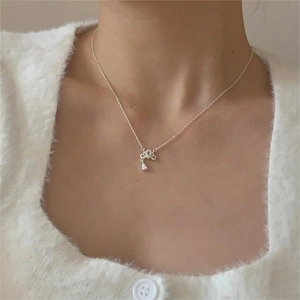 Detailed close-up of a pear-shaped cubic zirconia pendant on a 925 silver chain