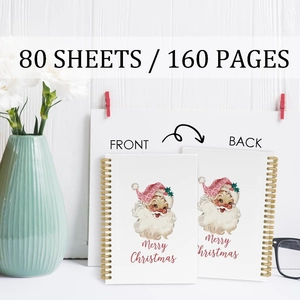 Christmas spiral notebook with 160 pages featuring Santa Claus illustration and merry text