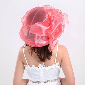 Detailed back view of pink organza fascinator hat with large 3D floral mesh design