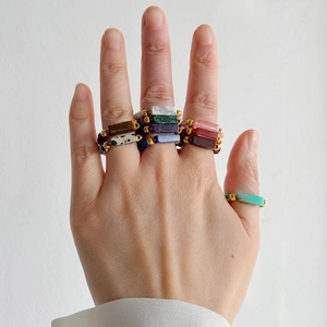 Detail of multi-color 4mm natural gemstone beaded rings featuring a rectangle centerpiece