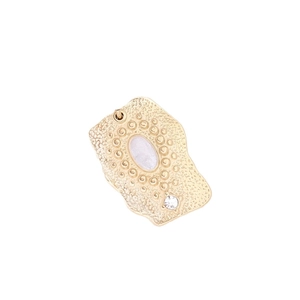 Irregular gold pendant necklace with white oval gemstone and embossed texture