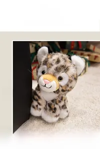 Detailed close-up of a realistic leopard plush toy with soft fur and bright eyes
