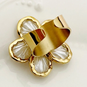 Elegant gold open ring featuring a white zircon flower design with shell luster finish