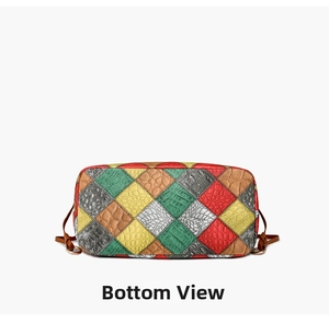 Macro view showing the bottom of the colorful patchwork leather shoulder bag with textures