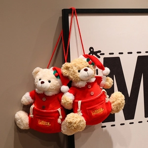 Christmas teddy bear plush pouch hanging on wall with Merry Christmas gold embroidery