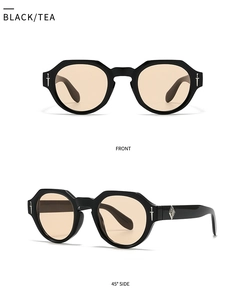 Detailansicht der Retro-Sonnenbrille mit schwarzem Rahmen, Teeglas und Dolchakzenten