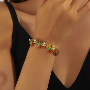 Gold stainless steel beaded bracelet with red enamel strawberry charm and white zircon stones