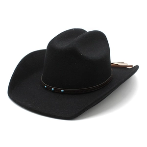 Detail of black wool fedora hat featuring brown band with turquoise studs and tassels