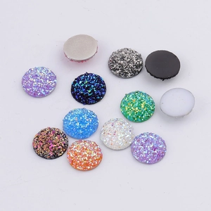 Detailed close-up of 14mm round colorful glitter resin druzy cabochons for DIY jewelry