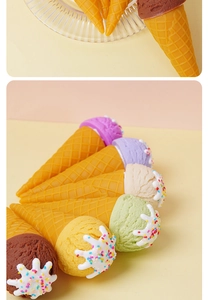 Macro shot of realistic PVC ice cream cones with colorful toppings and waffle texture