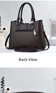 Rear view of brown handbag with monogram pattern featuring a functional zipper pocket